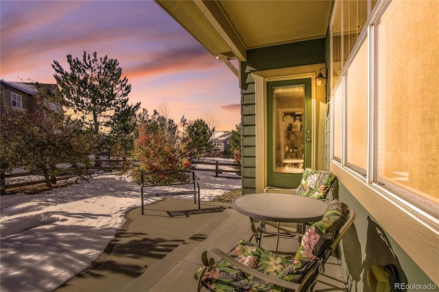 view of patio terrace at dusk