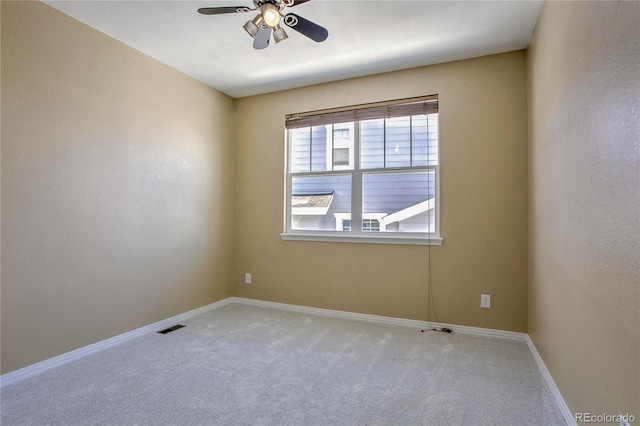 carpeted empty room with ceiling fan