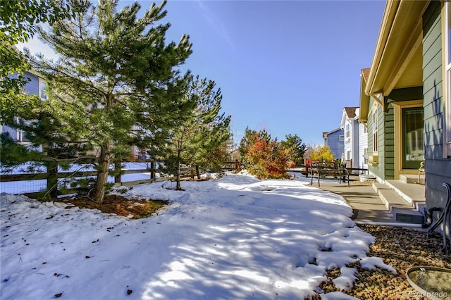 view of yard covered in snow