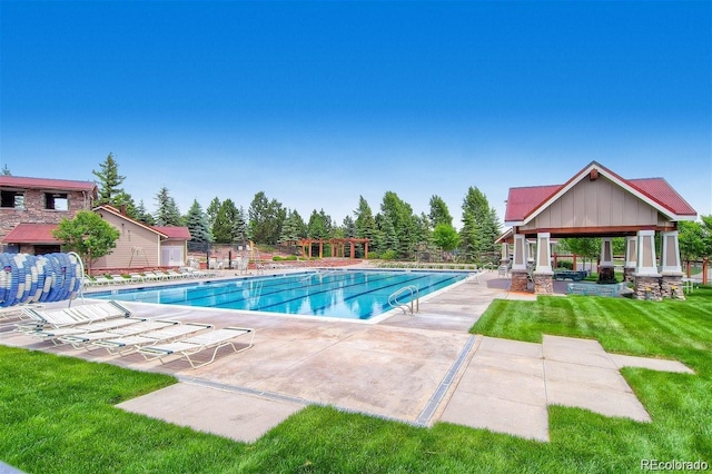 view of pool featuring a patio area, a gazebo, and a yard