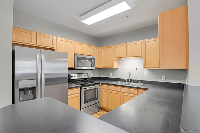 1780 N Washington St Unit 405, Denver, CO 80203 - kitchen with stainless steel appliances, light brown cabinetry, a sink, and dark countertops