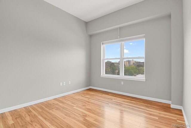 1780 N Washington St Unit 405, Denver, CO 80203 - spare room with light wood-style flooring and baseboards