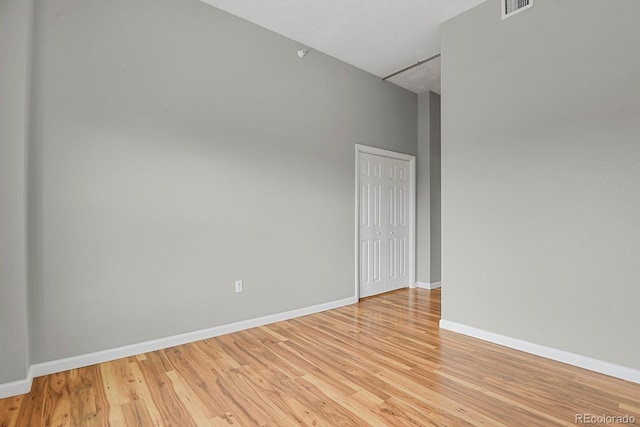 1780 N Washington St Unit 405, Denver, CO 80203 - spare room featuring light wood finished floors and baseboards