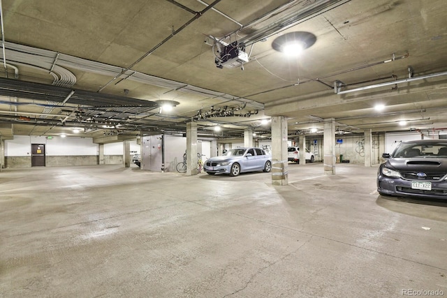 1780 N Washington St Unit 405, Denver, CO 80203 - parking deck featuring a garage door opener