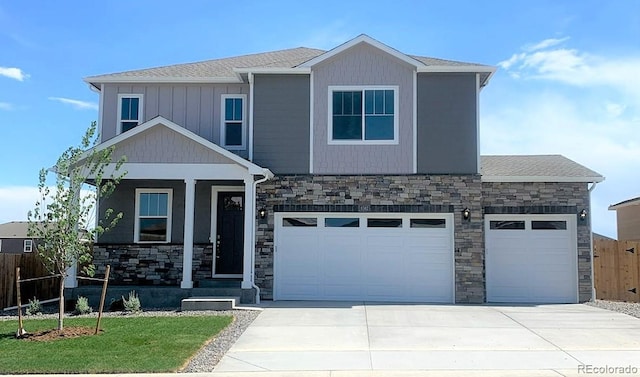 craftsman-style home with a front lawn, a porch, and a garage