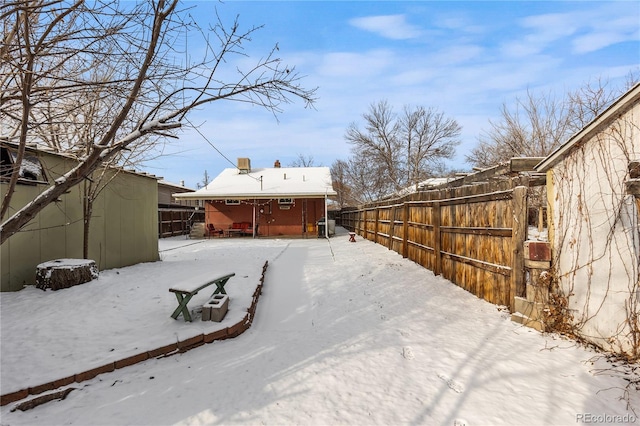 view of yard covered in snow