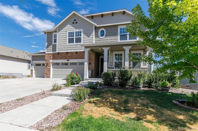 craftsman-style house with a porch, a garage, and a front yard