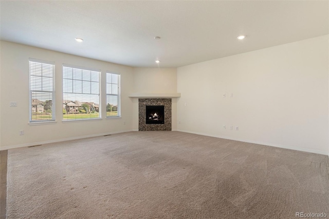 unfurnished living room with carpet floors