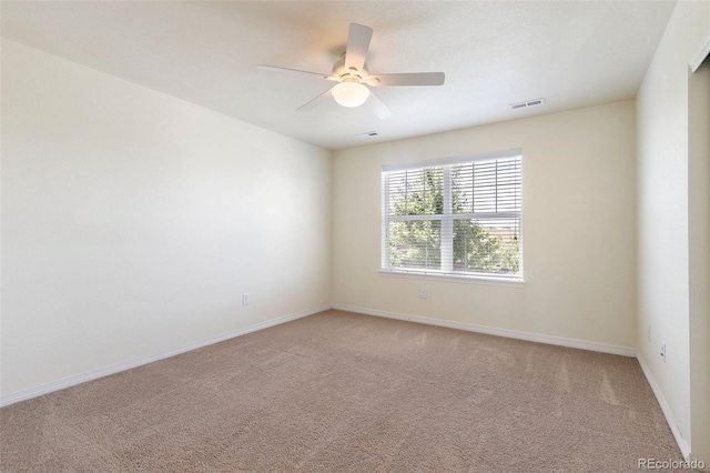 unfurnished room with carpet flooring and ceiling fan