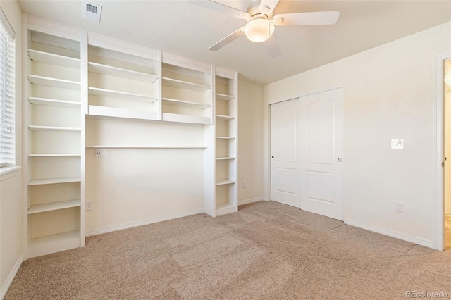 unfurnished bedroom with ceiling fan and light carpet