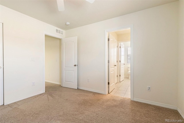 unfurnished room featuring ceiling fan and light carpet