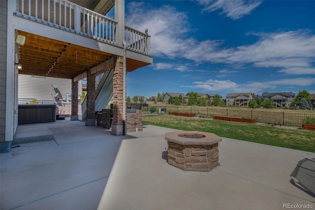 view of patio featuring a deck and a fire pit