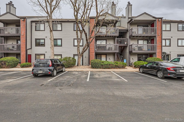 view of property with uncovered parking