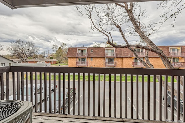 exterior space with central AC unit and a residential view