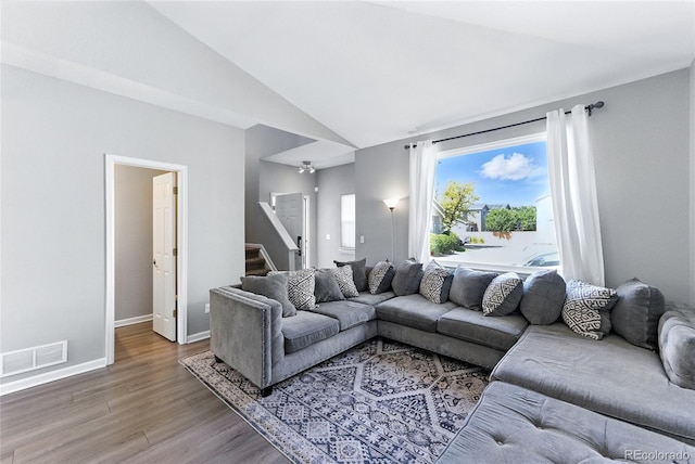 10116 Wyandott Cir, Denver, CO 80260 - living room with wood finished floors, stairway, and lofted ceiling