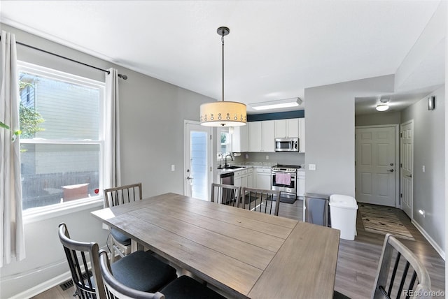 10116 Wyandott Cir, Denver, CO 80260 - dining room featuring wood finished floors and baseboards