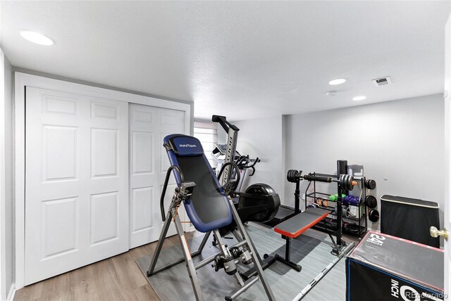10116 Wyandott Cir, Denver, CO 80260 - workout room featuring light wood-type flooring and recessed lighting