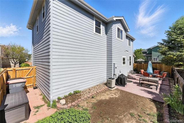 10116 Wyandott Cir, Denver, CO 80260 - view of side of home with a patio and a fenced backyard