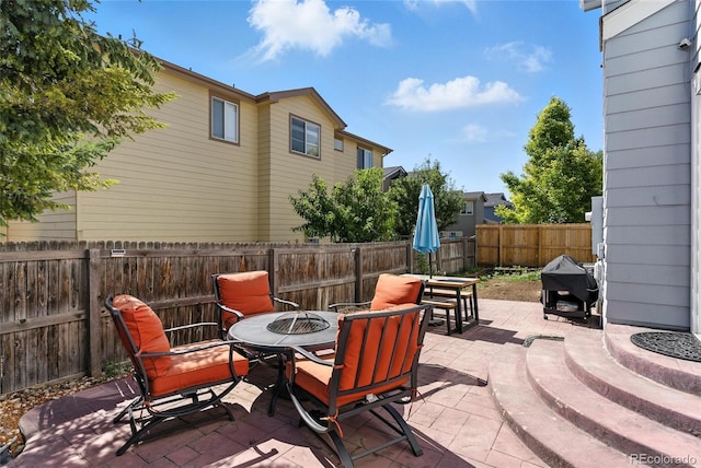 10116 Wyandott Cir, Denver, CO 80260 - fenced backyard featuring an outdoor fire pit and a patio