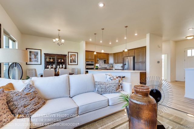 935 W 128th Pl, Westminster, CO 80234 - living area with a chandelier, light wood finished floors, and recessed lighting
