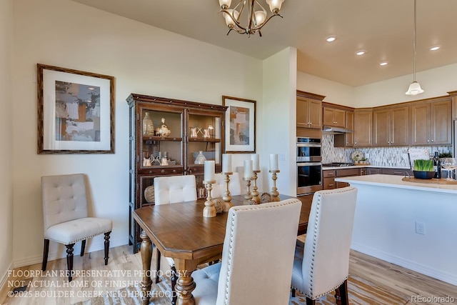 935 W 128th Pl, Westminster, CO 80234 - dining room with a chandelier, light wood finished floors, and recessed lighting