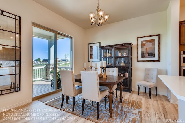 935 W 128th Pl, Westminster, CO 80234 - dining area featuring a chandelier and light wood-type flooring