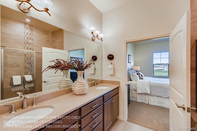 935 W 128th Pl, Westminster, CO 80234 - bathroom featuring connected bathroom, double vanity, and a tile shower