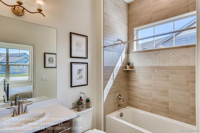 935 W 128th Pl, Westminster, CO 80234 - ensuite bathroom featuring healthy amount of natural light, bathing tub / shower combination, and vanity