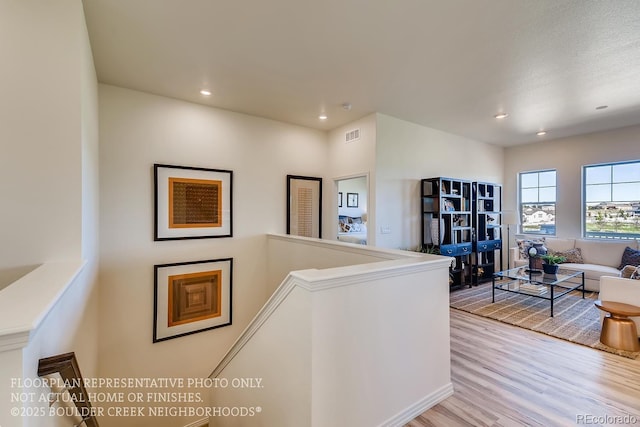 935 W 128th Pl, Westminster, CO 80234 - hallway with an upstairs landing, light wood-style floors, and recessed lighting