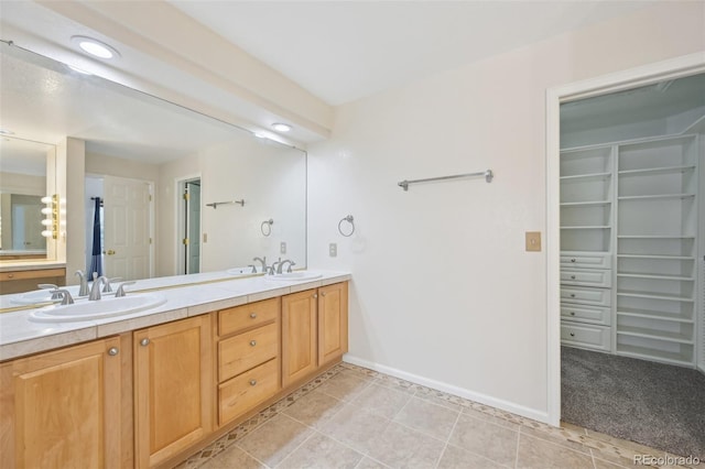2660 Timberchase Trl, Highlands Ranch, CO 80126 - bathroom with double vanity, a spacious closet, tile patterned floors, baseboards, and recessed lighting