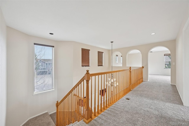 2660 Timberchase Trl, Highlands Ranch, CO 80126 - corridor featuring carpet, healthy amount of natural light, baseboards, recessed lighting, and arched walkways
