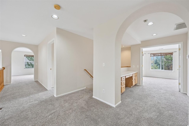 2660 Timberchase Trl, Highlands Ranch, CO 80126 - hall featuring arched walkways, light carpet, an upstairs landing, recessed lighting, and baseboards