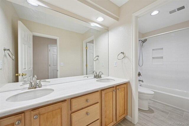 2660 Timberchase Trl, Highlands Ranch, CO 80126 - full bath featuring toilet, double vanity, shower / tub combination, and recessed lighting