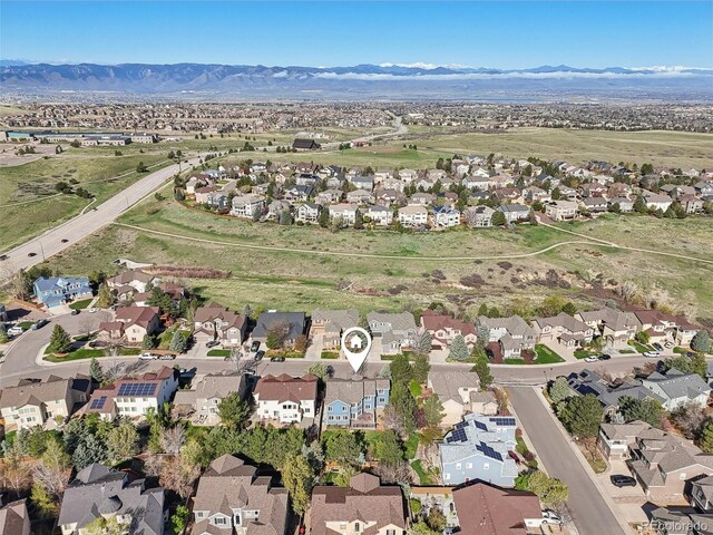 2660 Timberchase Trl, Highlands Ranch, CO 80126 - aerial overview of property's location featuring nearby suburban area and a mountain backdrop