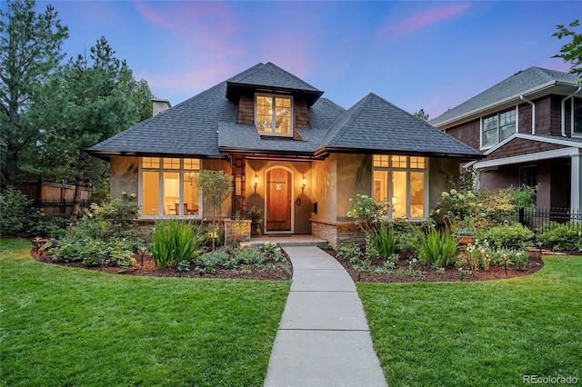 view of front of home featuring a lawn