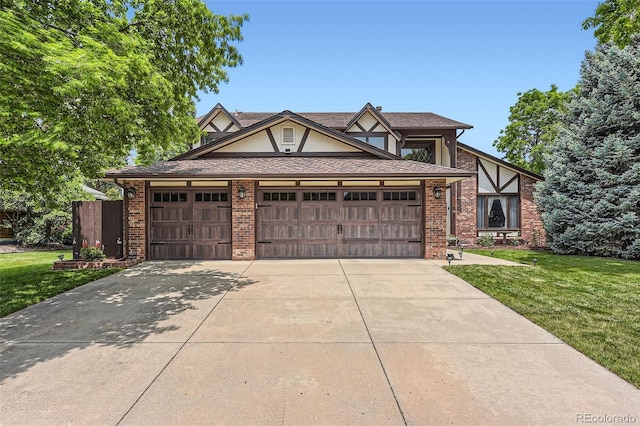 7863 W Friend Dr, Littleton, CO 80128 - tudor house featuring a front yard, brick siding, concrete driveway, and a garage