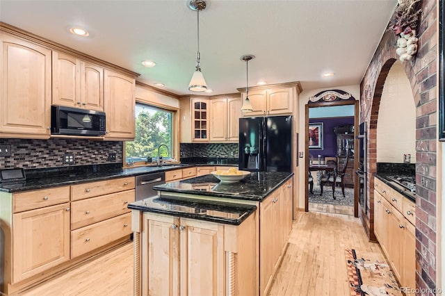7863 W Friend Dr, Littleton, CO 80128 - kitchen with black appliances, light brown cabinetry, light wood-type flooring, dark stone counters, and recessed lighting
