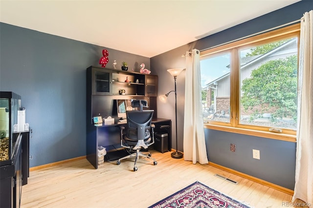 7863 W Friend Dr, Littleton, CO 80128 - office area with light wood-style flooring and baseboards