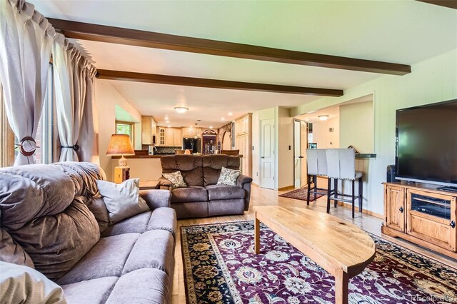 7863 W Friend Dr, Littleton, CO 80128 - living room with wood finished floors and beam ceiling