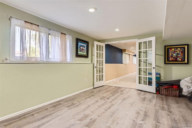 7863 W Friend Dr, Littleton, CO 80128 - spare room with french doors, wood finished floors, baseboards, and recessed lighting