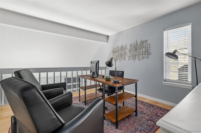 office space featuring wood finished floors and baseboards