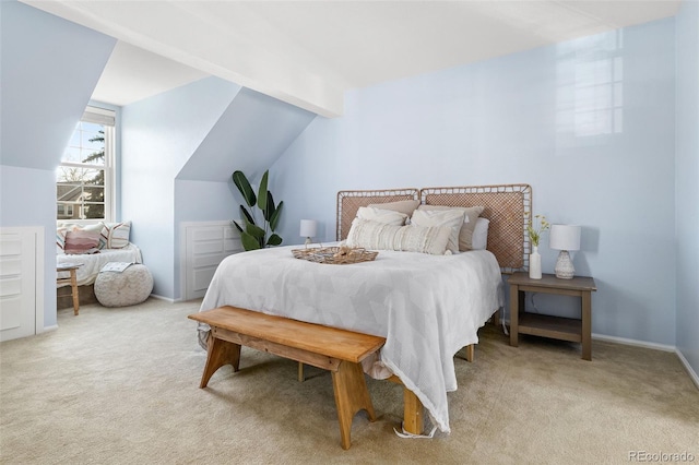 bedroom with light carpet, baseboards, and vaulted ceiling