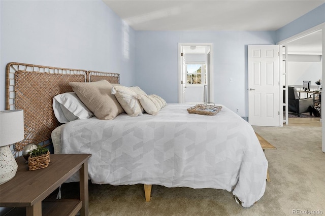 bedroom with light colored carpet