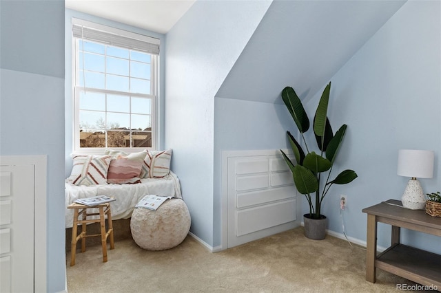 sitting room featuring vaulted ceiling, carpet floors, and baseboards