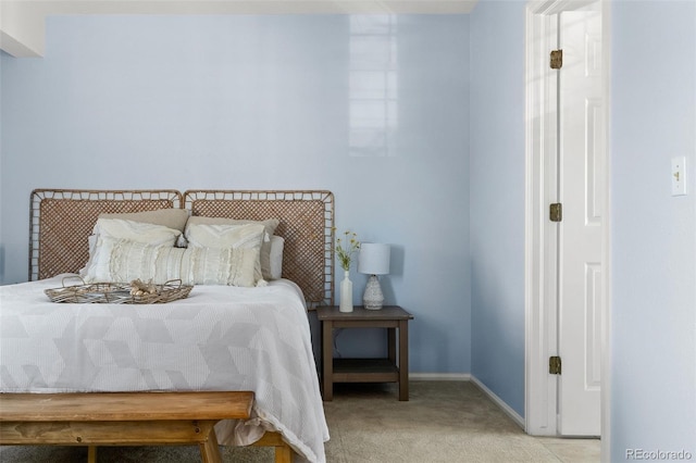 bedroom with carpet flooring and baseboards