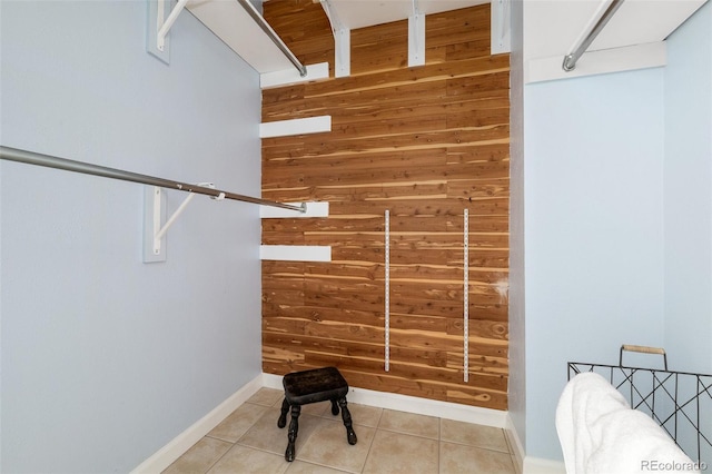 spacious closet with tile patterned floors