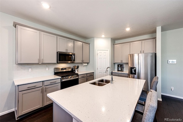 469 S Olathe St, Aurora, CO 80017 - kitchen with stainless steel appliances, gray cabinetry, a sink, baseboards, and recessed lighting