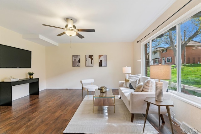 12708 W Virginia Ave, Lakewood, CO 80228 - living area featuring wood finished floors, healthy amount of natural light, ceiling fan, and baseboards