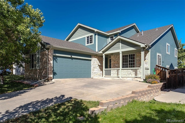 view of front of house with a porch and a garage