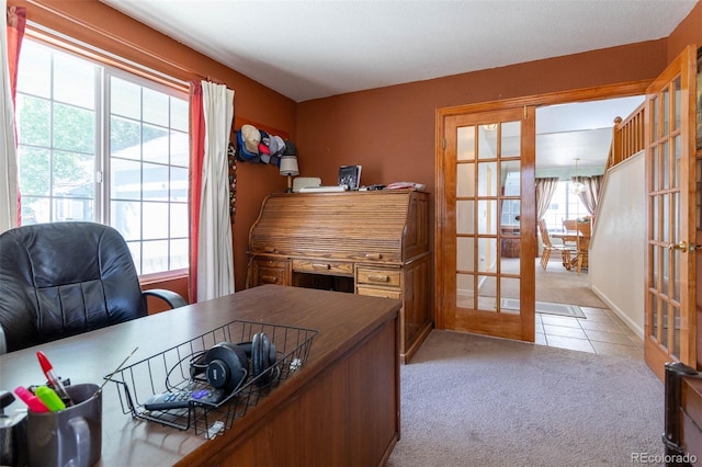 carpeted office with french doors